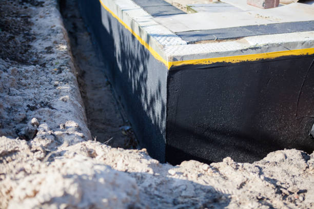 Professional Waterproofing technician working in Oneonta, NY